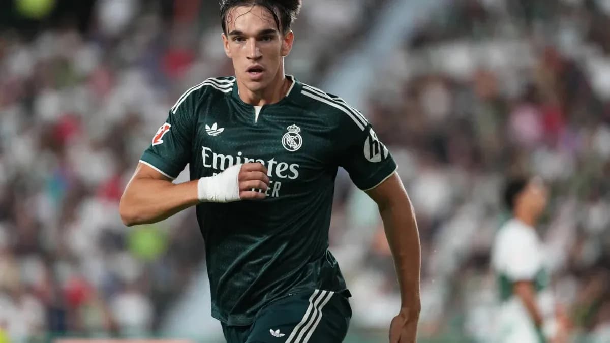 Player sprinting in green Real Madrid kit