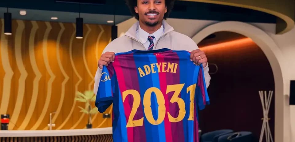 Player holding Barcelona jersey with 'ADEYEMI' and '2031'