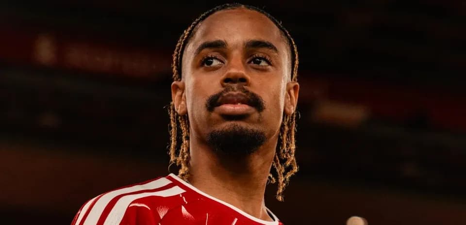 Player wearing red jersey, looking focused