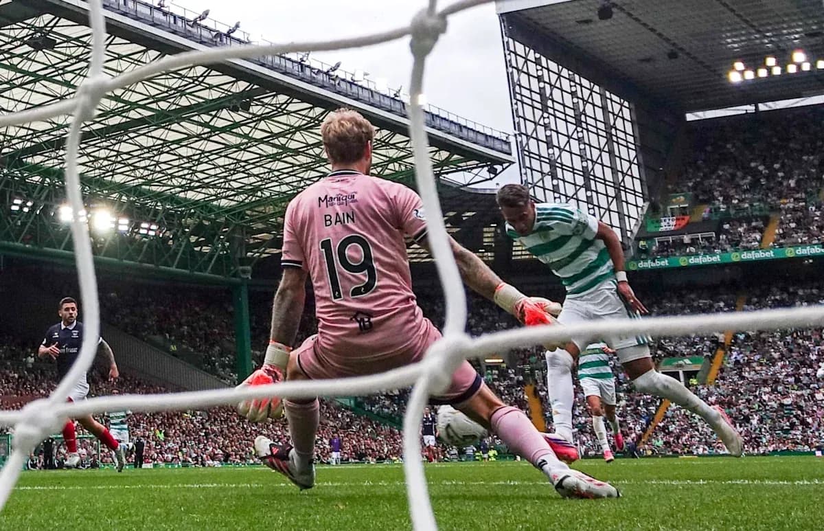 Celtic player attempting to score against goalkeeper Bain