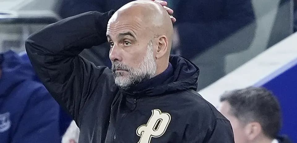 Coach observing match with hand on head