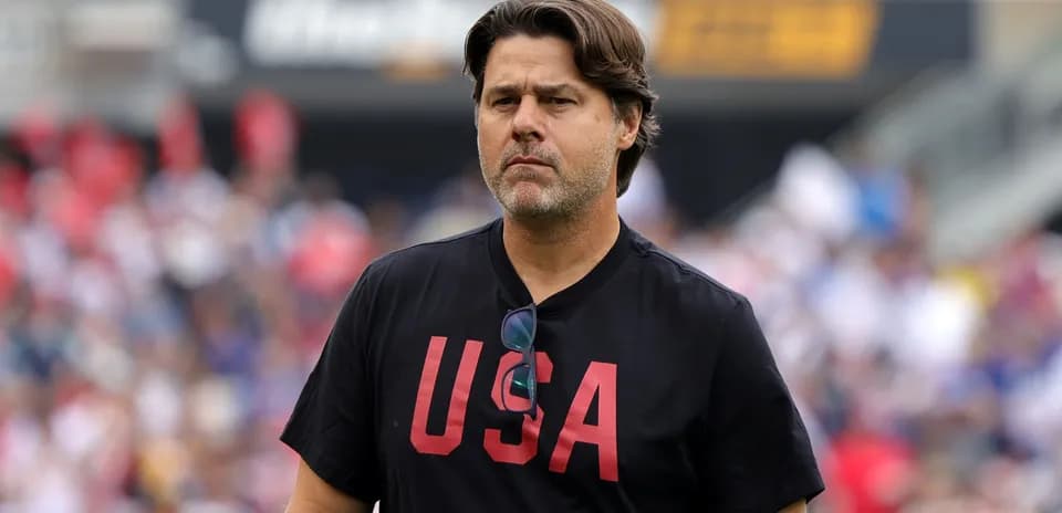Coach wearing USA shirt on the field