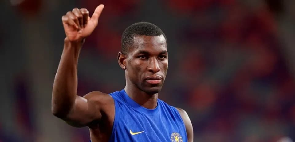 Player in blue jersey giving thumbs up gesture