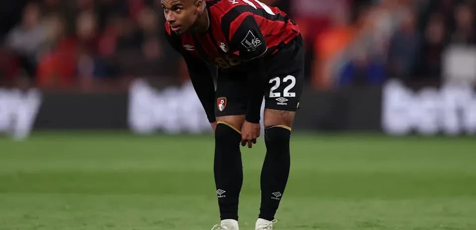 Bournemouth player bending down on the pitch