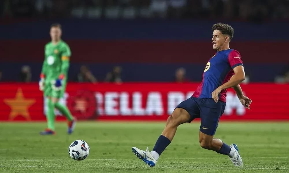 Player kicking ball during football match