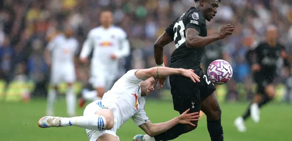 Player tackled while dribbling the ball during match