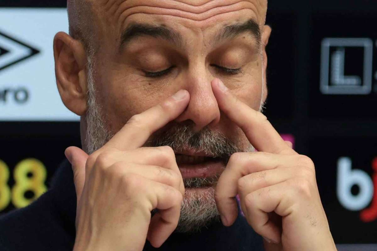 Manager gesturing during a press conference