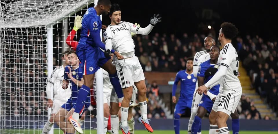 Chelsea player attempting a header in match