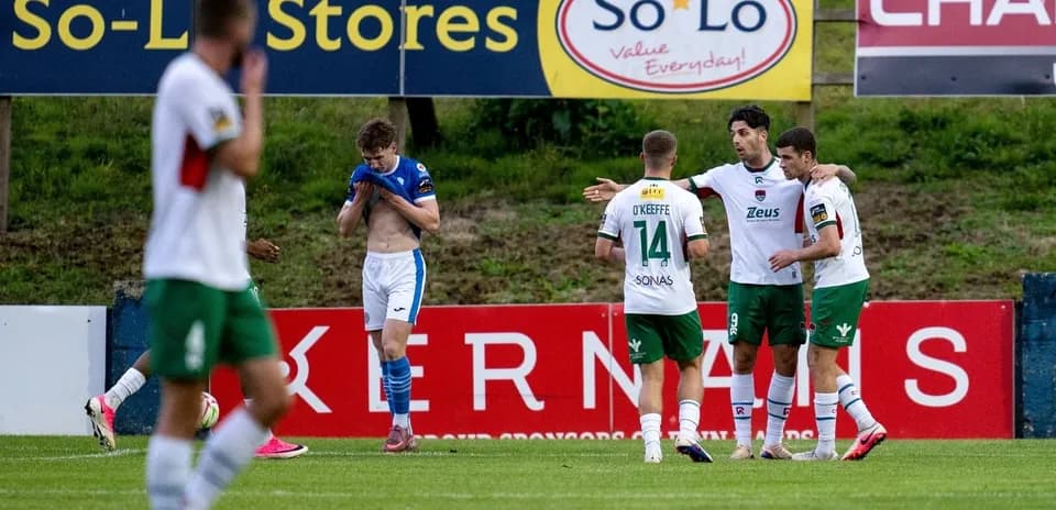 Players celebrating a goal on the field