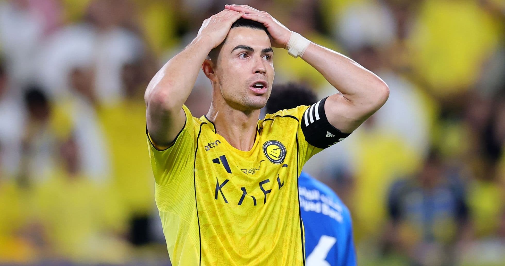 Player in yellow jersey reacting during match