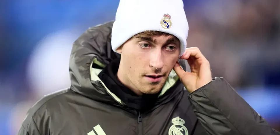 Player in Real Madrid gear wearing a beanie