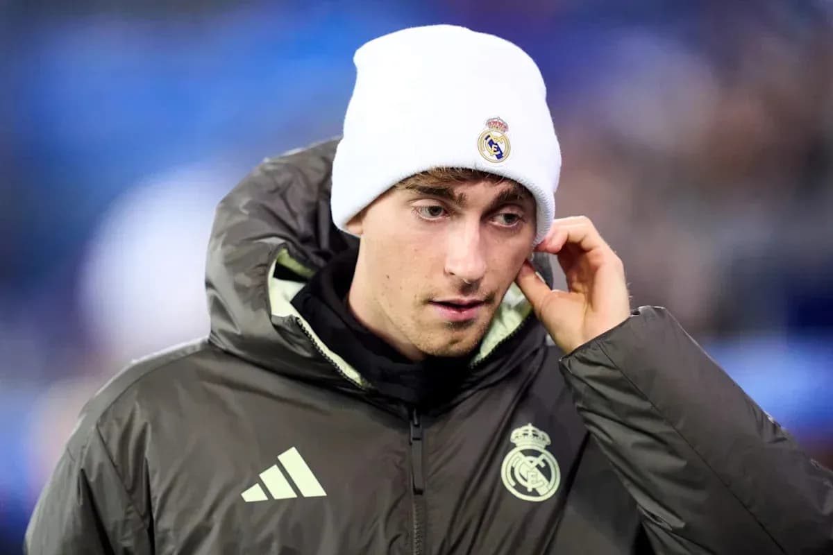 Player in Real Madrid gear wearing a beanie