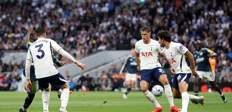 Players from Tottenham defending against an opponent