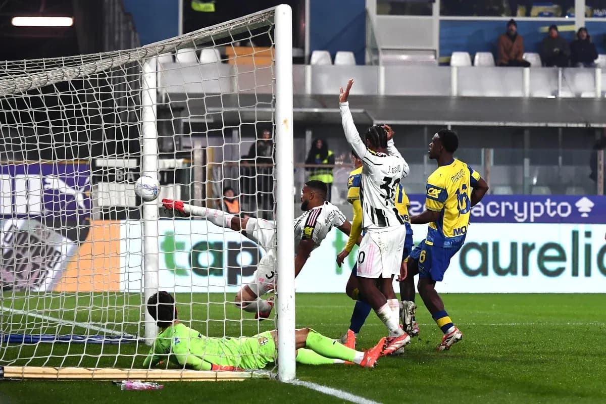Goalkeeper saves shot during Juventus vs Parma match