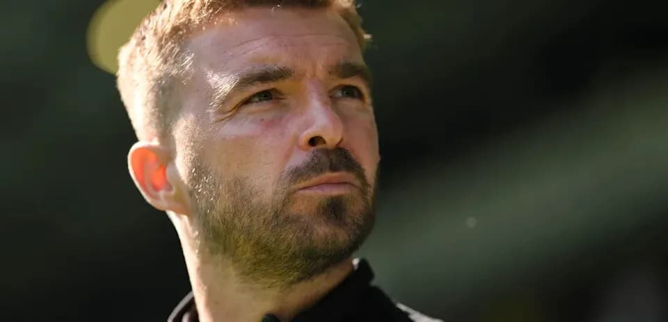 Coach looking thoughtfully during training session