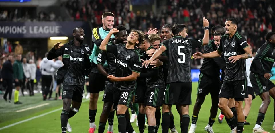 Players celebrating a goal during Champions League match