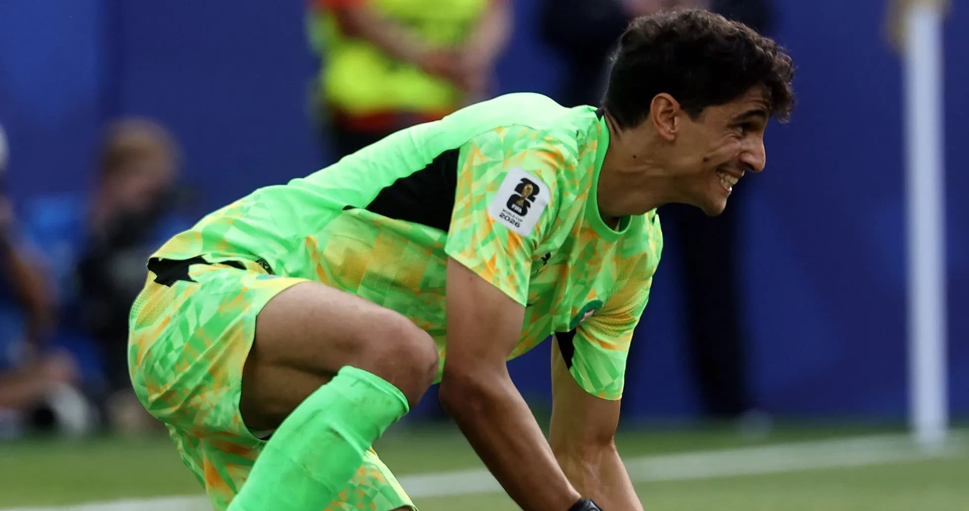 Goalkeeper in bright green kit during match