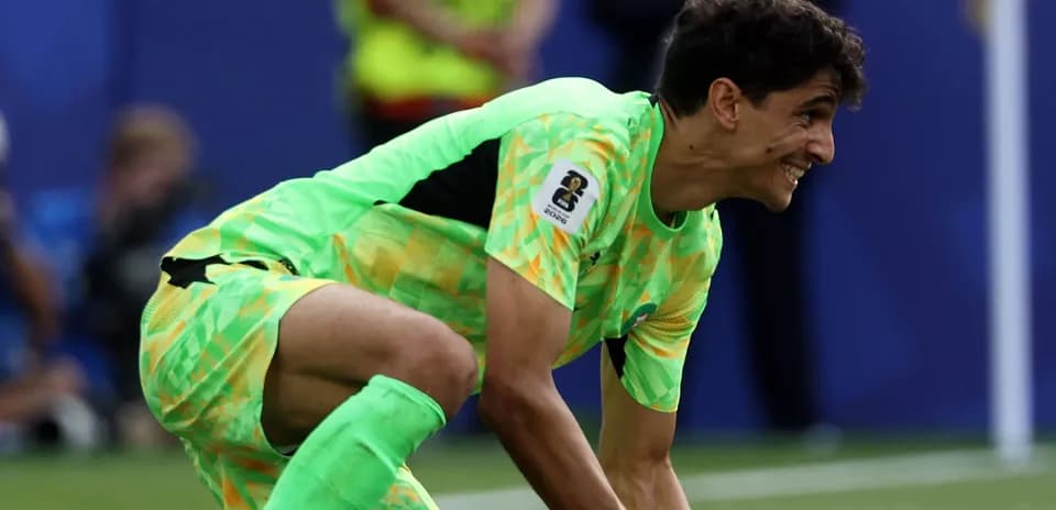 Goalkeeper in bright green kit during match