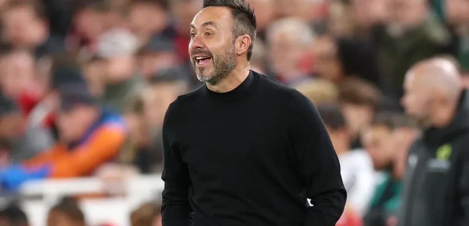 Coach gesturing on the sidelines during match