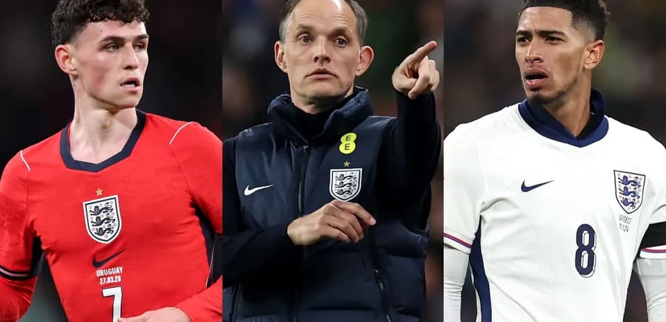 Three football players in England kits during match
