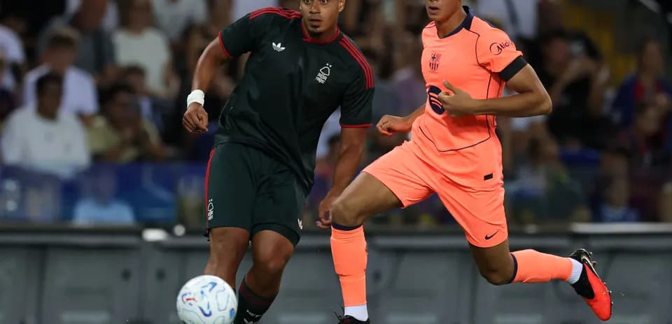 Two players competing for the ball during match