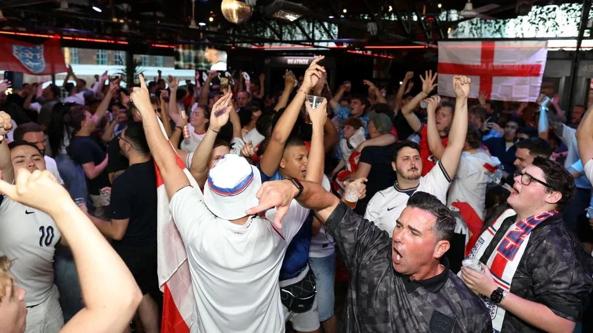 Crowd of fans celebrating in a sports bar