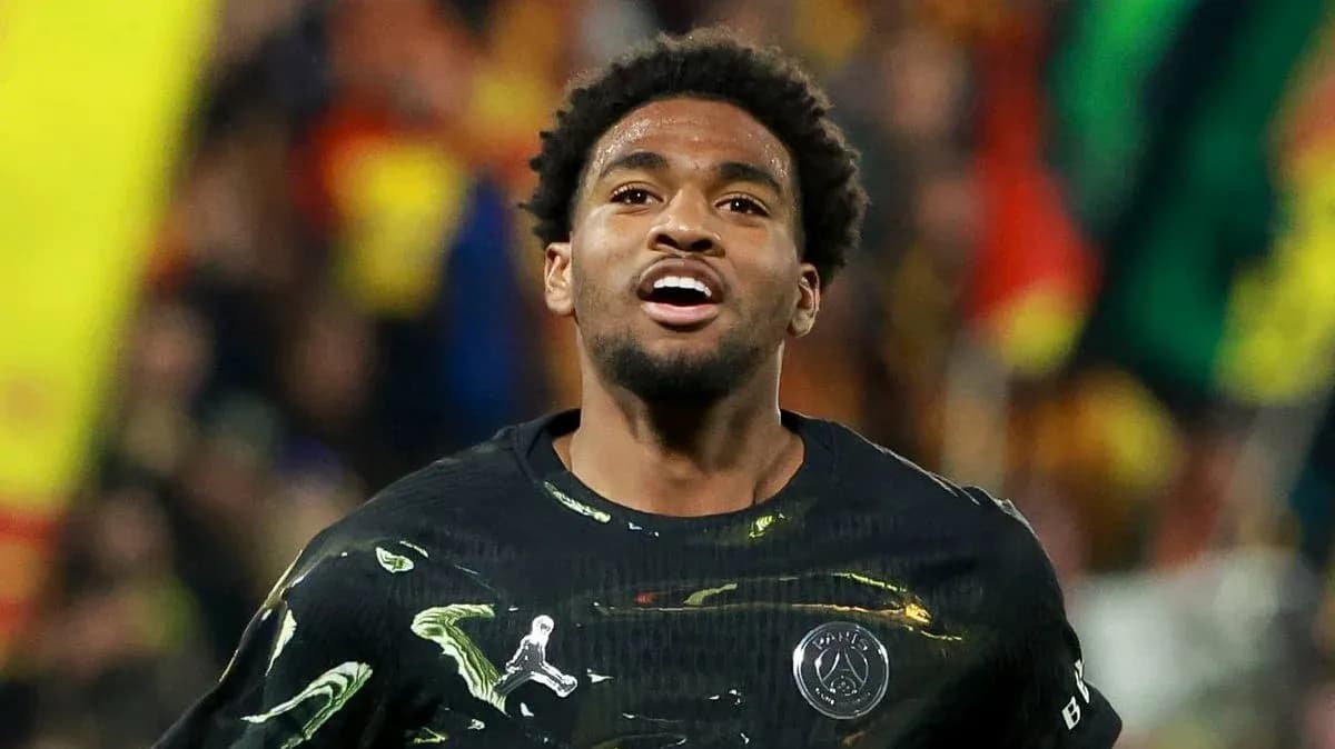 Player celebrating during match with fans in background