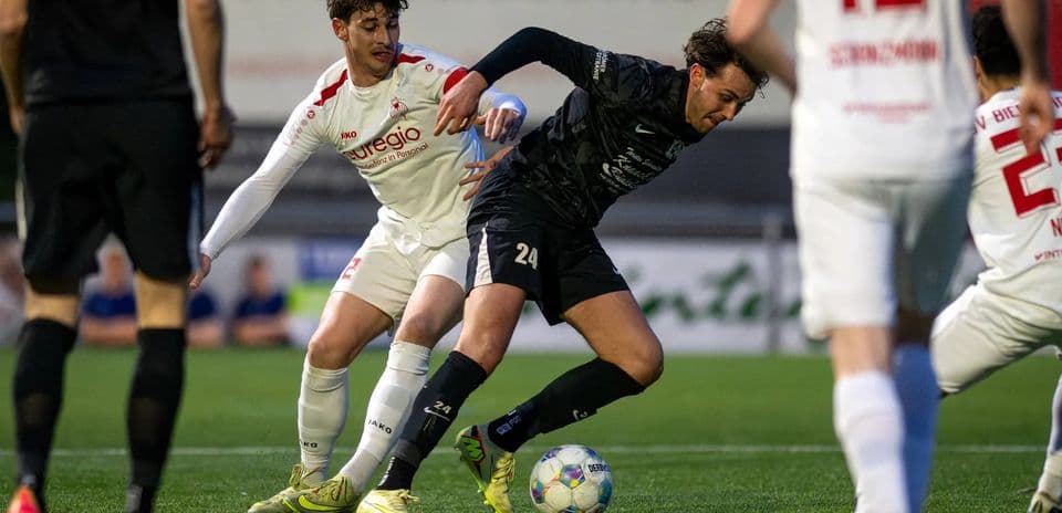 Players battling for possession during match