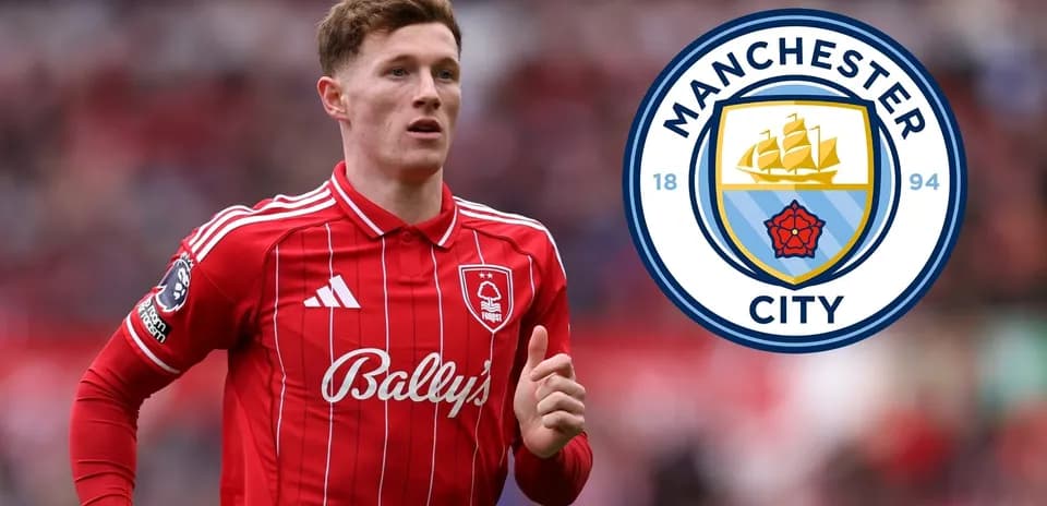 Player in red jersey with Manchester City logo