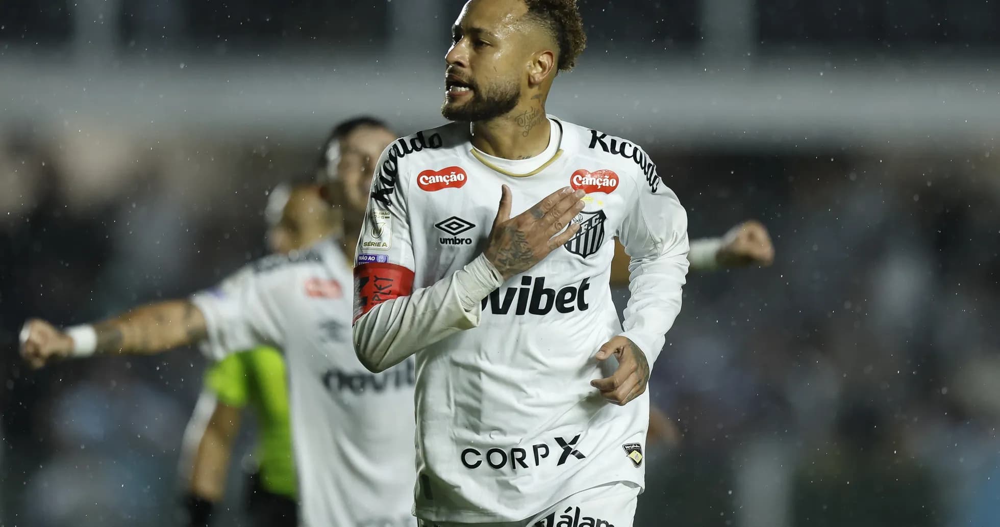 Neymar celebrating after scoring a goal for Santos