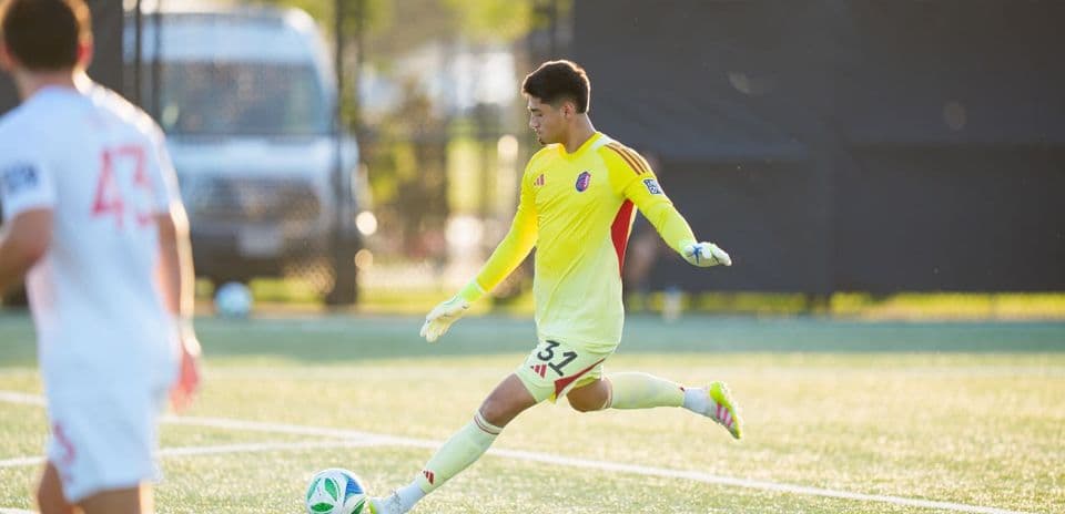 Goalkeeper taking a kick during match