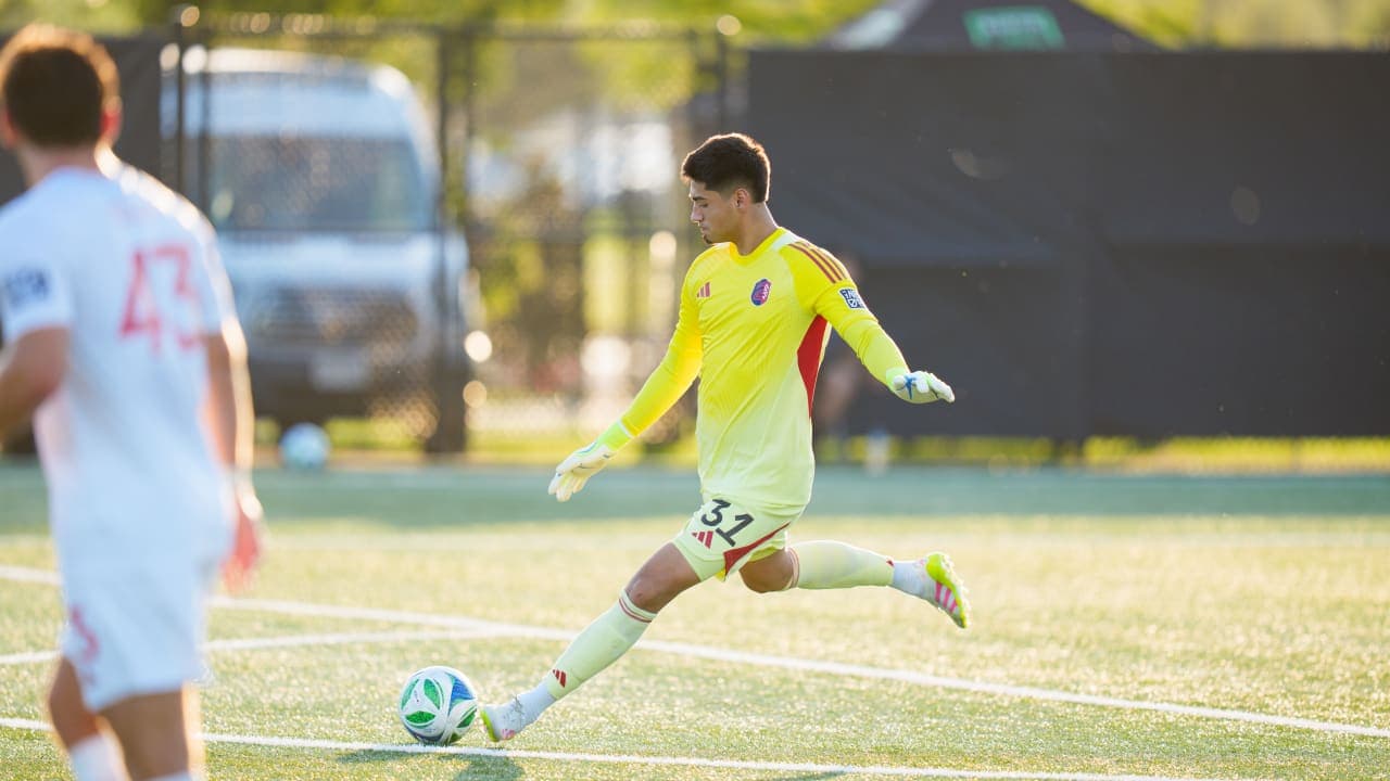 Goalkeeper taking a kick during match