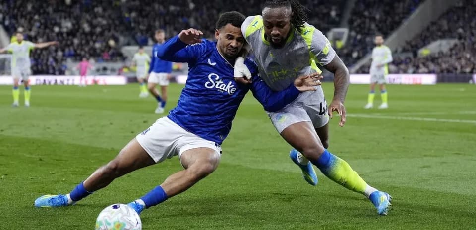 Players battling for the ball on the field
