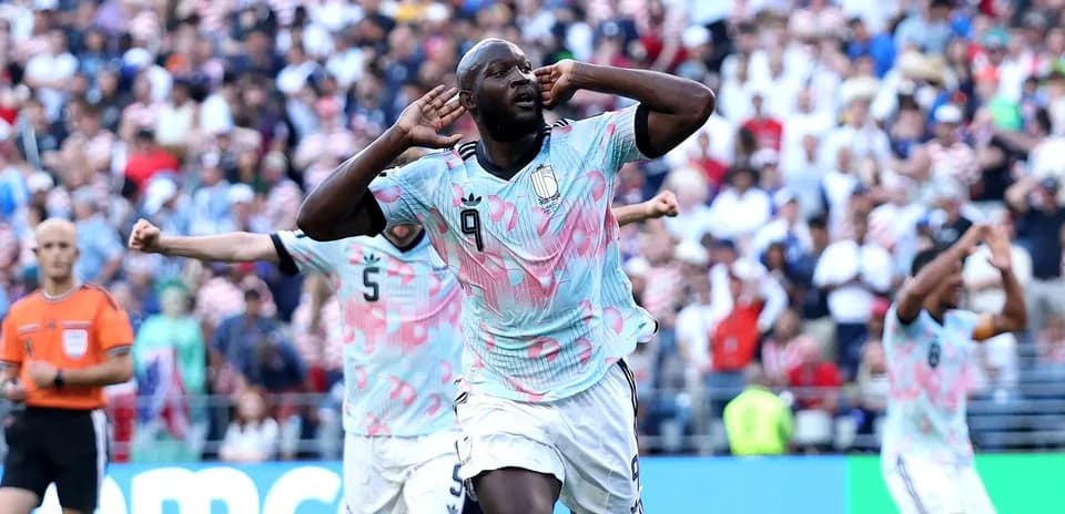 Player celebrating a goal with hands to ears