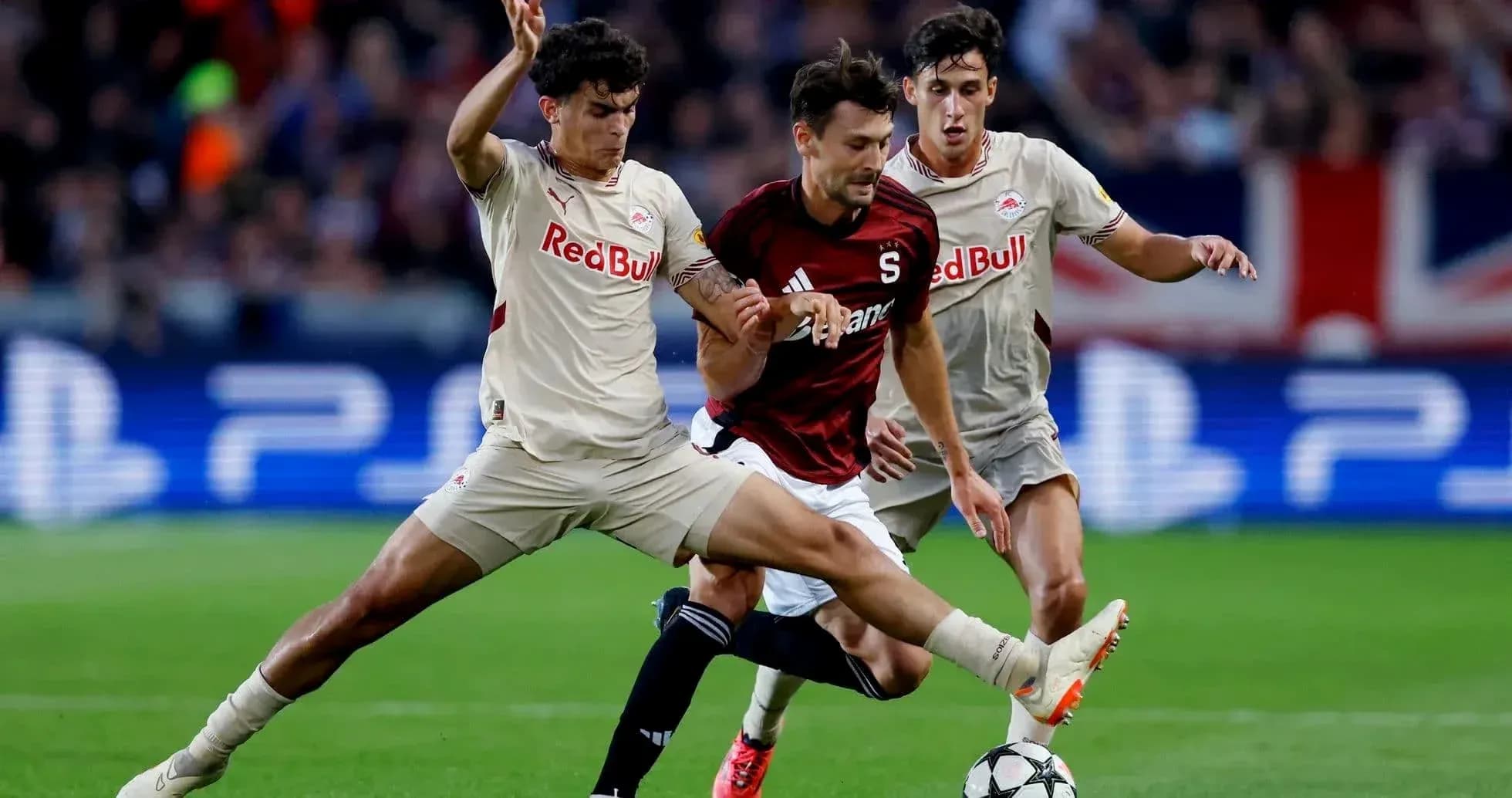 Players competing for the ball during Europa League match