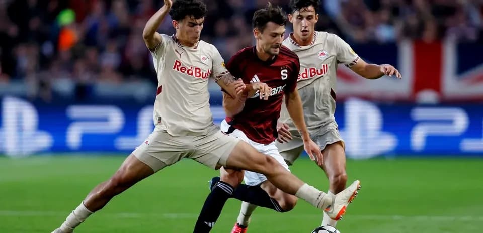 Players competing for the ball during Europa League match