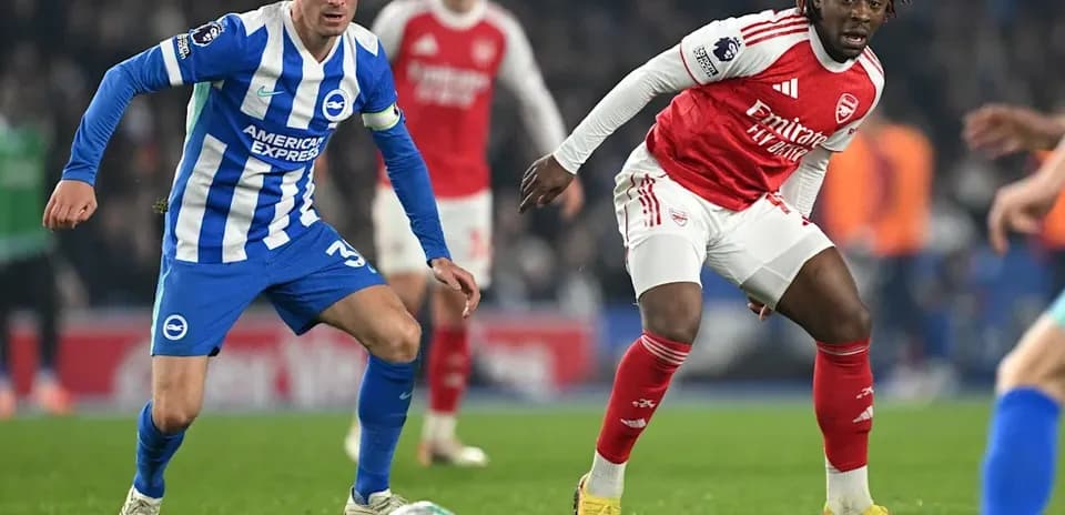 Two players competing for the ball during match
