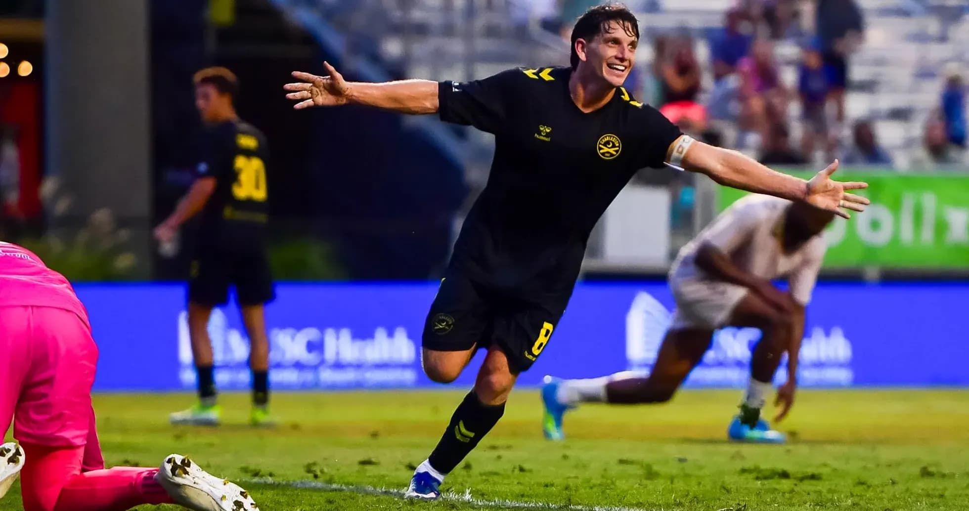 Player celebrating a goal during Charleston Battery match
