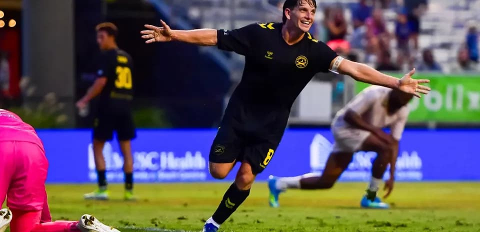 Player celebrating a goal during Charleston Battery match