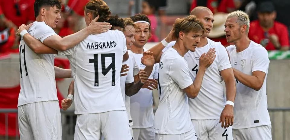 Players celebrating after scoring a goal during match