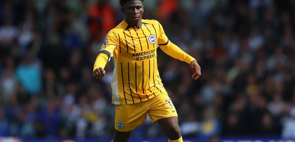 Player in yellow jersey running on the field