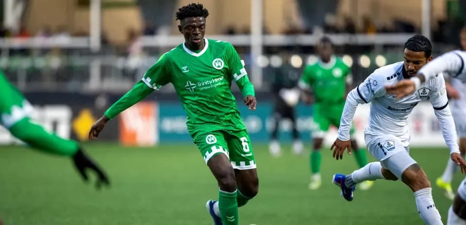 NY Cosmos player dribbling against Hartford Athletic