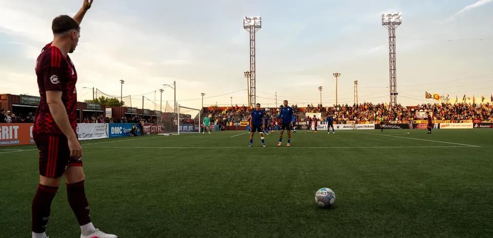 Detroit City players preparing for a free kick