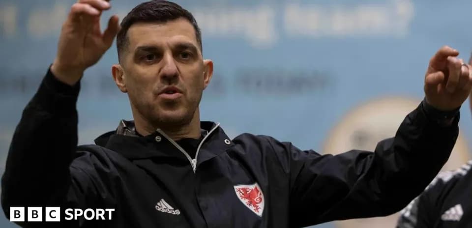 Coach gesturing during a training session indoors