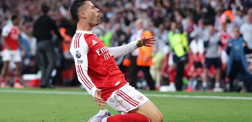 Arsenal player celebrating goal on the pitch