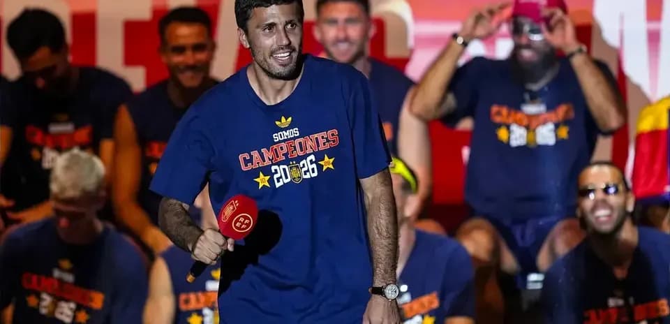 Player celebrating on stage with teammates