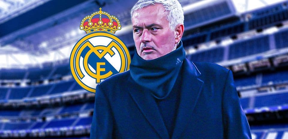 Coach standing in front of Real Madrid stadium backdrop