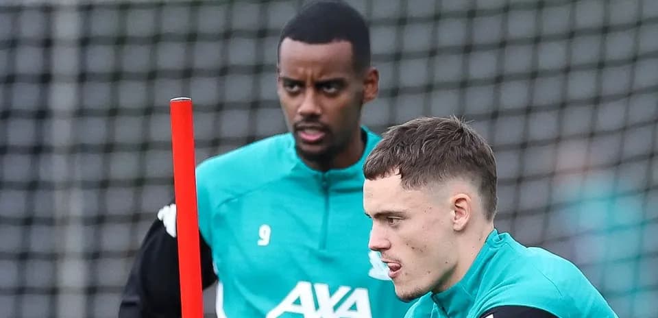 Two players training with a marker during session