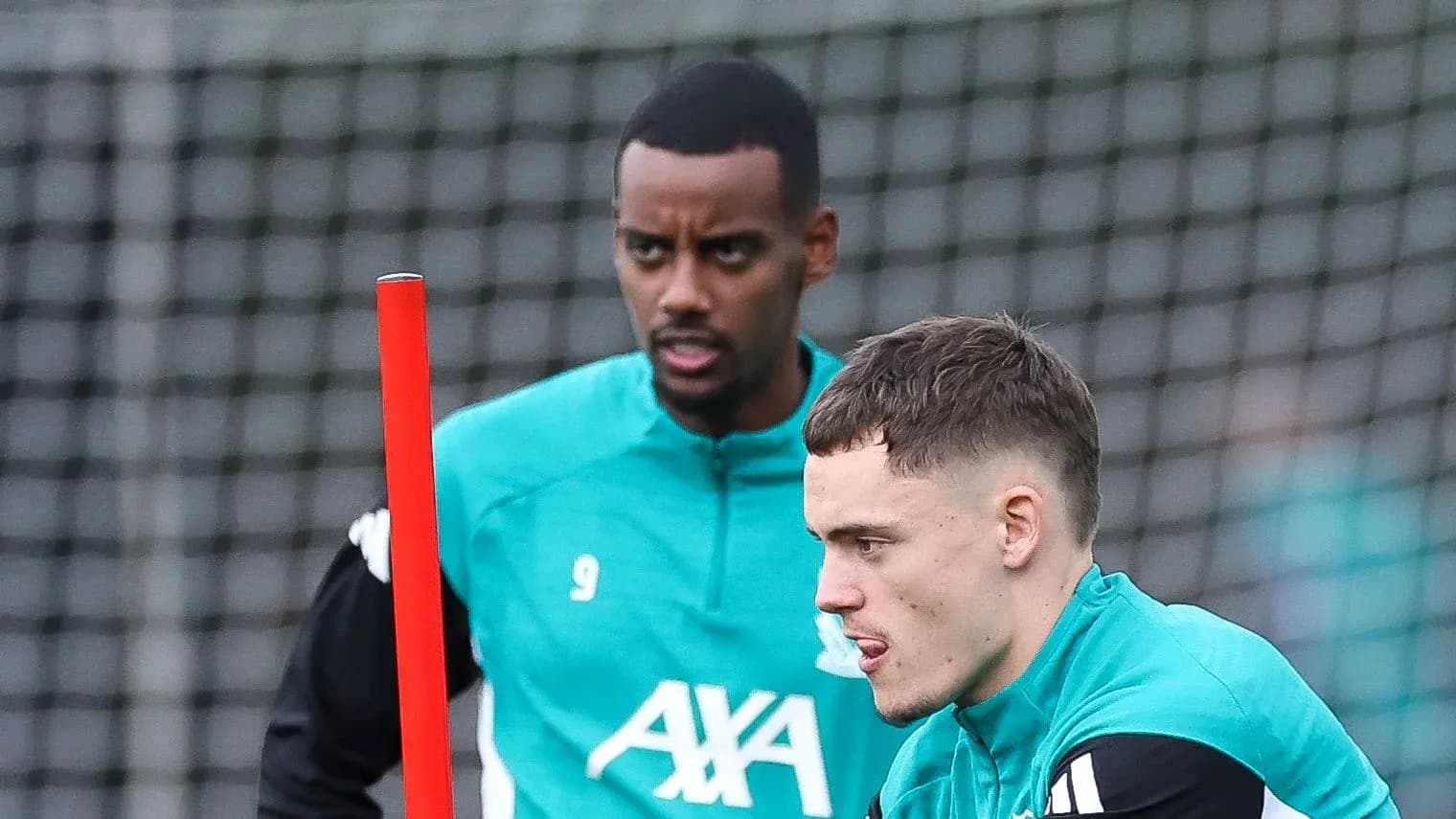 Two players training with a marker during session