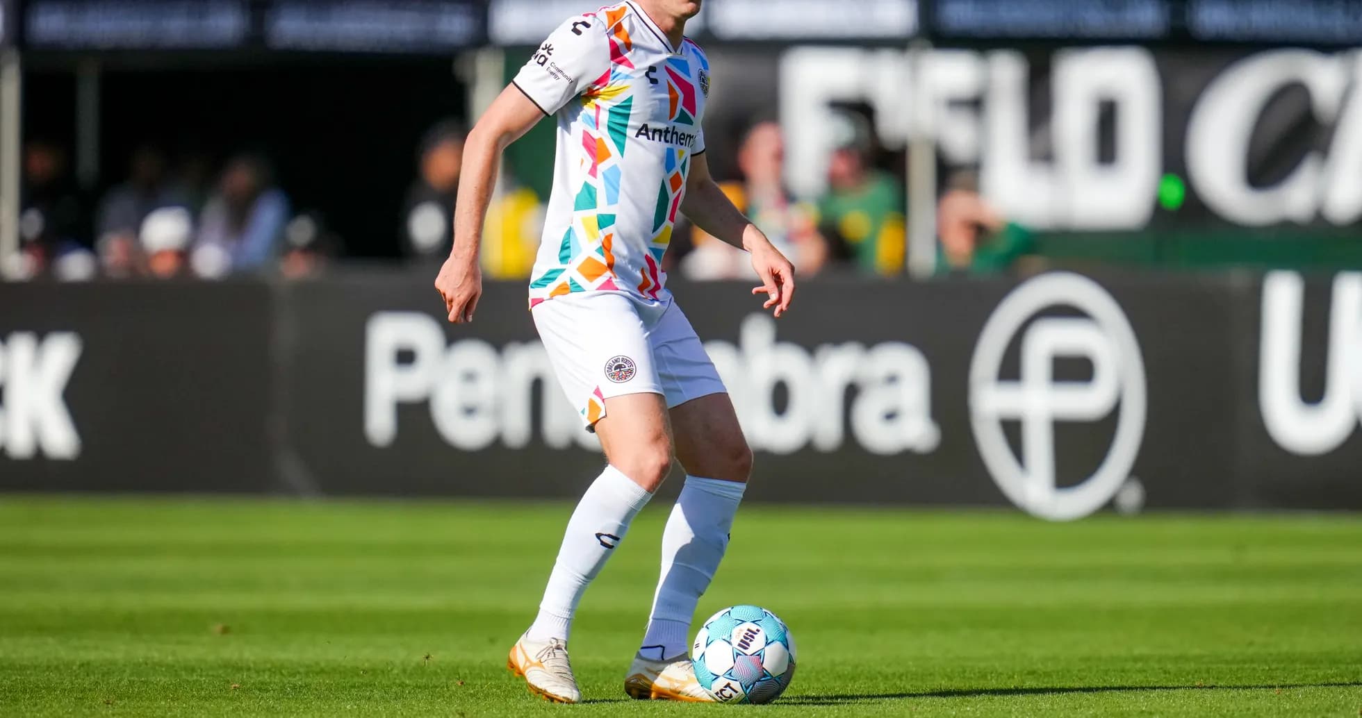 Player dribbling the ball on the field